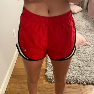 red nike shorts